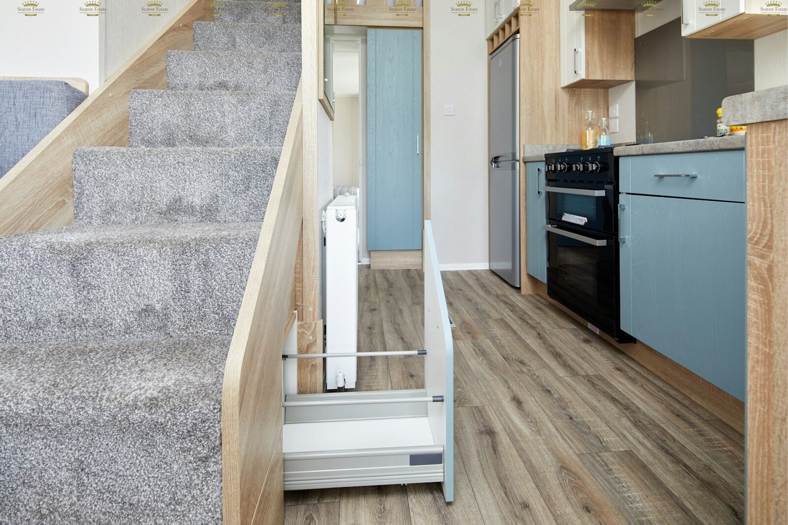 brown wooden staircase near white wooden door